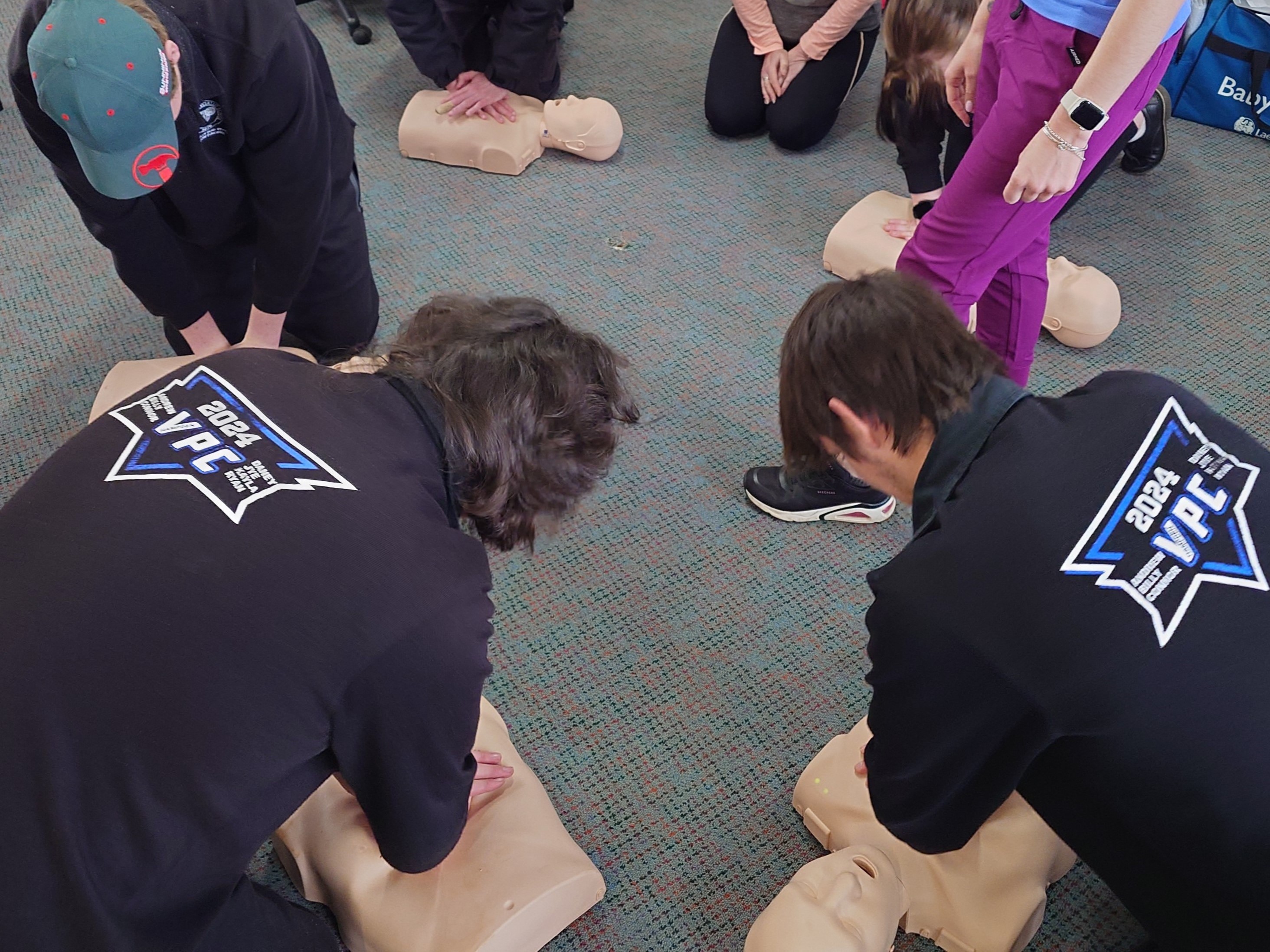 Students learning CPR
